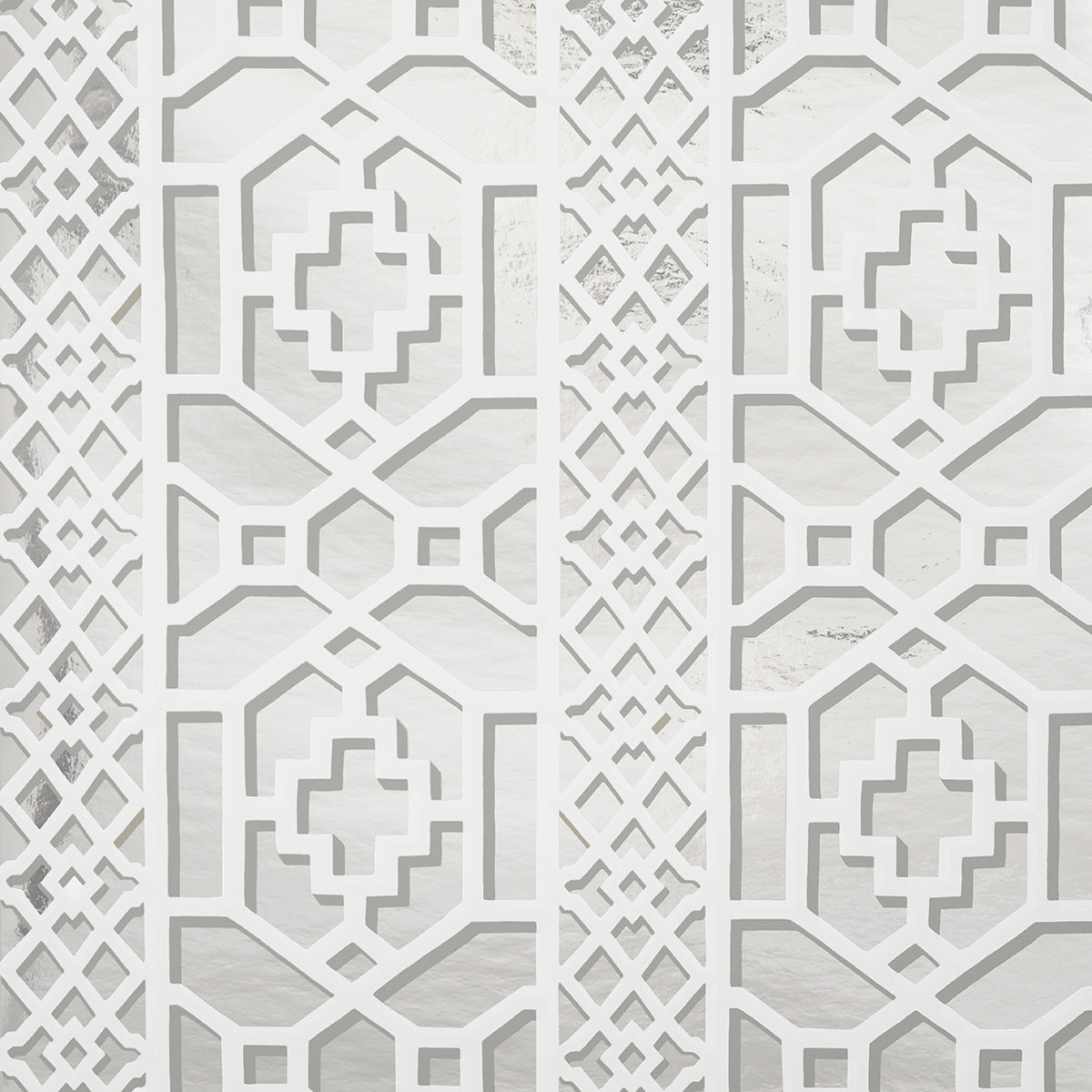 Zanzibar Trellis Mylar wallpaper in silver mylar, a glamorous geometric fretwork pattern with metallic shine by Schumacher.