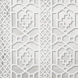 Zanzibar Trellis Mylar wallpaper in silver mylar, a glamorous geometric fretwork pattern with metallic shine by Schumacher.