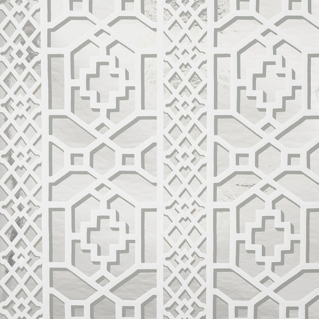 Zanzibar Trellis Mylar wallpaper in silver mylar, a glamorous geometric fretwork pattern with metallic shine by Schumacher.