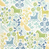 LUPITA wallpaper in blues and greens with whimsical animal and floral motifs by Schumacher, shown in a styled interior and close-up views.