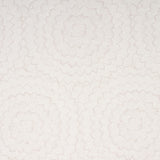 Feather Bloom wallpaper in soft neutral by Celerie Kemble for Schumacher, featuring a radiating overscale blossom pattern.