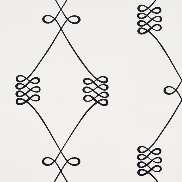 Nicolette wallpaper in black on cream, featuring a swirling trellis motif by Schumacher.