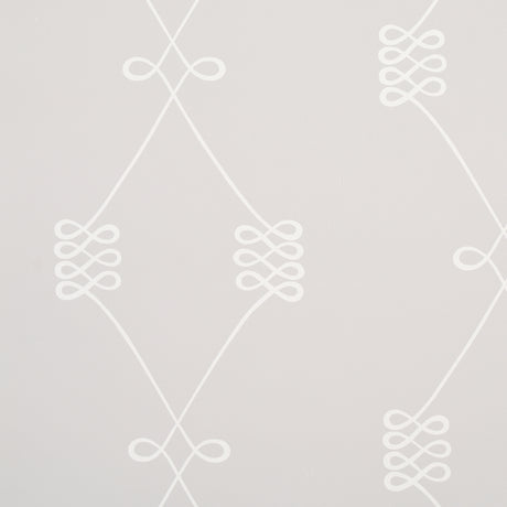 Nicolette wallpaper in white on grey, featuring a swirling trellis motif by Schumacher.