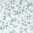 Garden Gate wallpaper in violet with a painterly floral and leafy design, shown in a styled interior and close-up views.