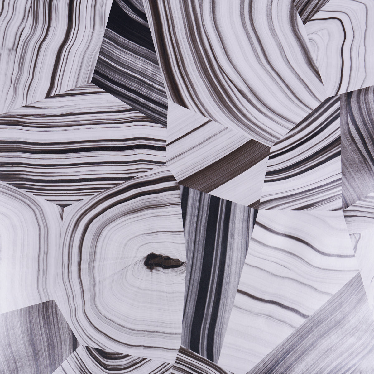 Black and white abstract agate slice patterned wallpaper by Schumacher, designed by Miles Redd, shown in a styled interior and close-up views.