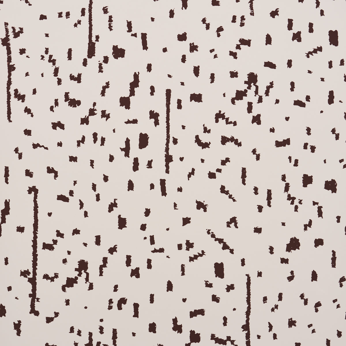 Bespotted brown abstract spotted wallpaper by Schumacher, shown in detail and installed in a modern living room.