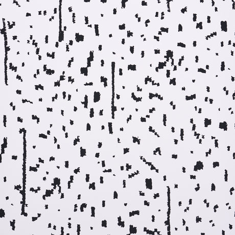 BESPOTTED wallpaper in black and white abstract spotted pattern by Schumacher, shown in a modern living room setting.