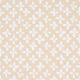Emerson wallpaper in ivory on beige by Schumacher, featuring a small-scale quatrefoil-inspired print with a hand-painted feel.