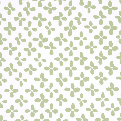 Emerson green-on-ivory small-scale quatrefoil print wallpaper by Schumacher, shown in close-up, roll, and room setting.