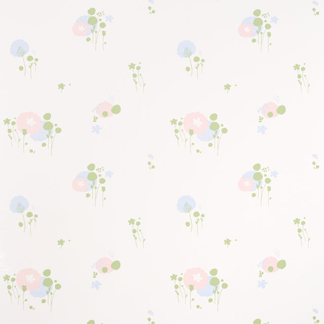 Pom Pom Forest wallpaper in ivory by Marie-Chantal for Schumacher, featuring a delicate small-scale floral pattern.