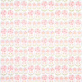 Anjuna Floral Blush wallpaper by Schumacher featuring stylized pink flowers in a hand-block print style, inspired by antique Suzani textiles.