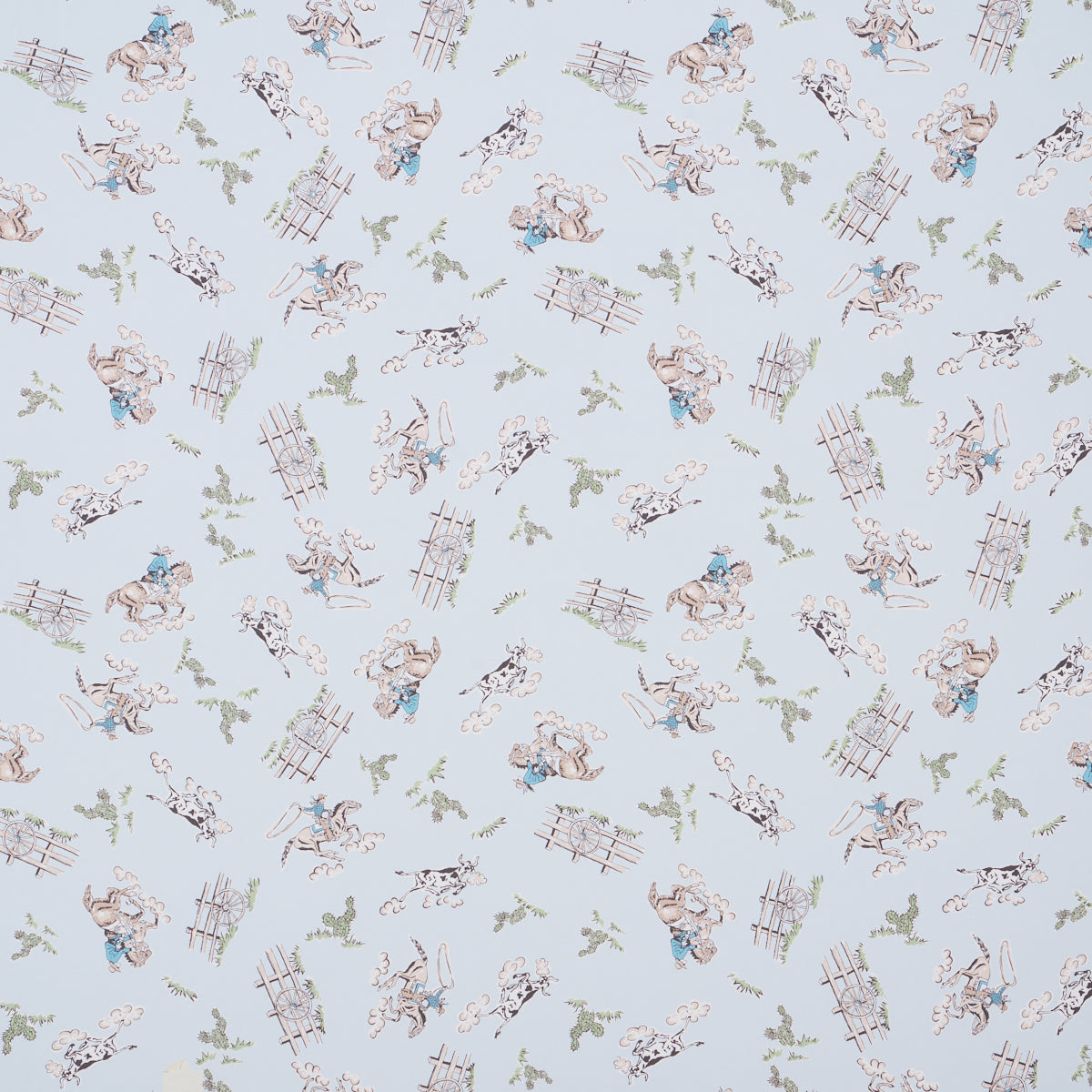 Wild West wallpaper in blue by Marie-Chantal for Schumacher, featuring playful cowboys and cowgirls in a vintage Western motif.