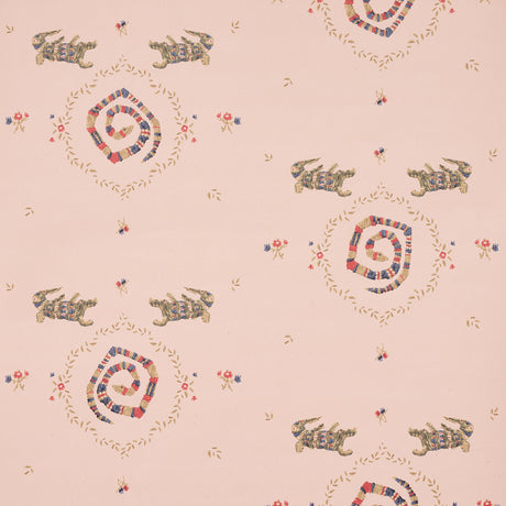 Reptilia wallpaper in muted pink with playful embroidered alligators, snakes, and floral motifs by Schumacher