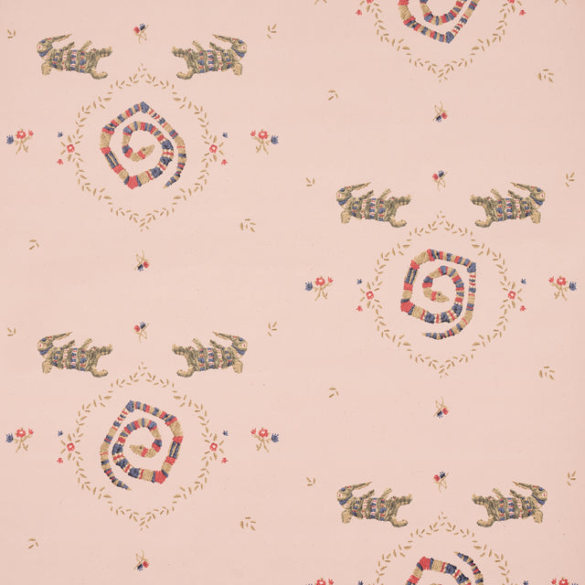 Reptilia wallpaper in muted pink with playful embroidered alligators, snakes, and floral motifs by Schumacher