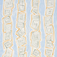 Taboo Sky by Backdrop for Schumacher - abstract hand-drawn vertical stripe wallpaper in blue, gold, and white, shown in a modern interior setting.