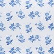 Colline Porcelain by Schumacher - Small-scale blue floral wallpaper with stippled background, shown in room and detail views.