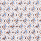 Basile Trellis wallpaper in Delft & Sepia by Schumacher, a leafy lattice geometric print in blue and brown tones, shown in detail and installed in a bathroom.