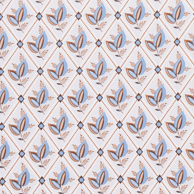 Basile Trellis wallpaper in Delft & Sepia by Schumacher, a leafy lattice geometric print in blue and brown tones, shown in detail and installed in a bathroom.