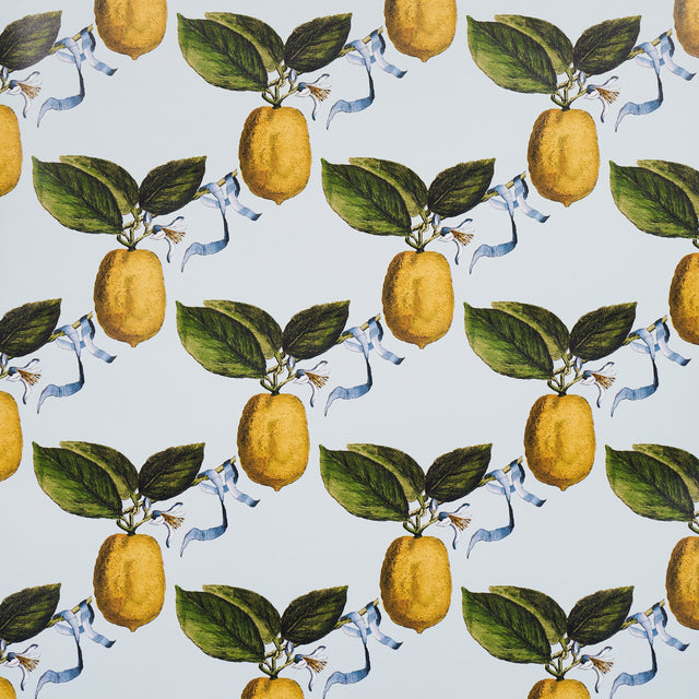 Le Citron Sky wallpaper by Johnson Hartig for Schumacher, featuring a whimsical lemon and ribbon pattern on a light blue background.