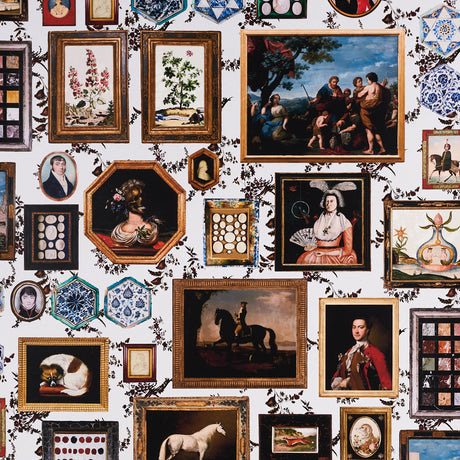 Le Grand Tour wallpaper by Johnson Hartig for Schumacher, featuring a collage of antique paintings, collectibles, and floral motifs in ornate frames.