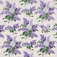 Proust's Lilacs wallpaper by Schumacher, featuring large-scale purple lilac floral clusters with green leaves on a light background, designed by Johnson Hartig.