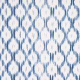 Santa Monica Indigo by Mark D. Sikes for Schumacher - blue and white ikat-inspired wallpaper in a bedroom setting