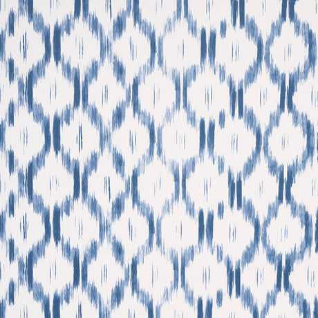 Santa Monica Indigo by Mark D. Sikes for Schumacher - blue and white ikat-inspired wallpaper in a bedroom setting