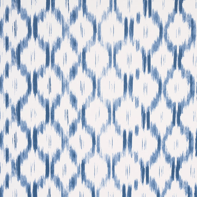 Santa Monica Indigo by Mark D. Sikes for Schumacher - blue and white ikat-inspired wallpaper in a bedroom setting