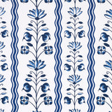 Delft Waves blue and white floral and wavy stripe wallpaper by Marie-Anne Oudejans for Schumacher, shown in styled and close-up views.