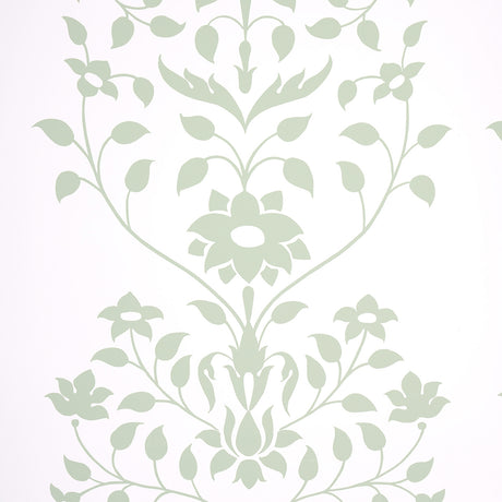 Jaipur Mughal Flower wallpaper in green by Schumacher, featuring a stylized floral pattern inspired by Mughal motifs, shown in a modern interior setting.