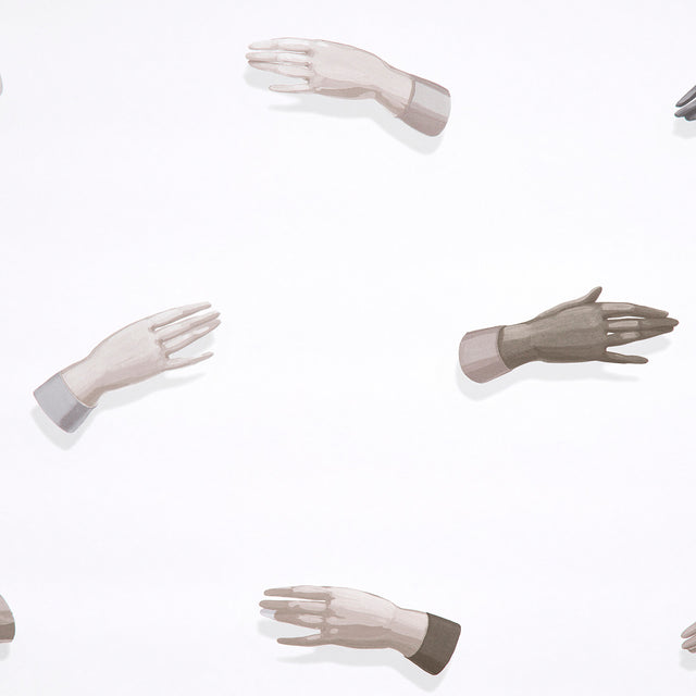 Manos wallpaper in neutral by Charlap Hyman & Herrero for Schumacher, featuring surrealist hand motifs on a white background.