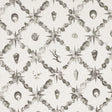 Grotto Treillage wallpaper in Grisaille by Charlap Hyman & Herrero for Schumacher, featuring a collage of shells and marine motifs in a trellis pattern.