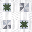 Alexander wallpaper in Dutch Green & Slate by Schumacher, featuring a geometric quilt-inspired pattern with pinwheel and star motifs.