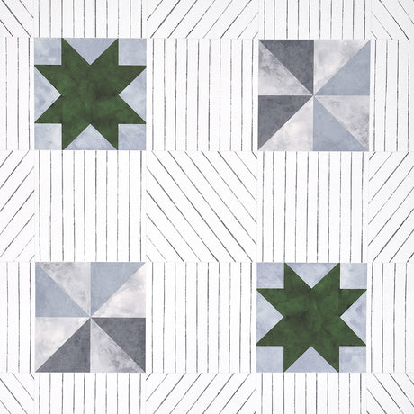 Alexander wallpaper in Dutch Green & Slate by Schumacher, featuring a geometric quilt-inspired pattern with pinwheel and star motifs.