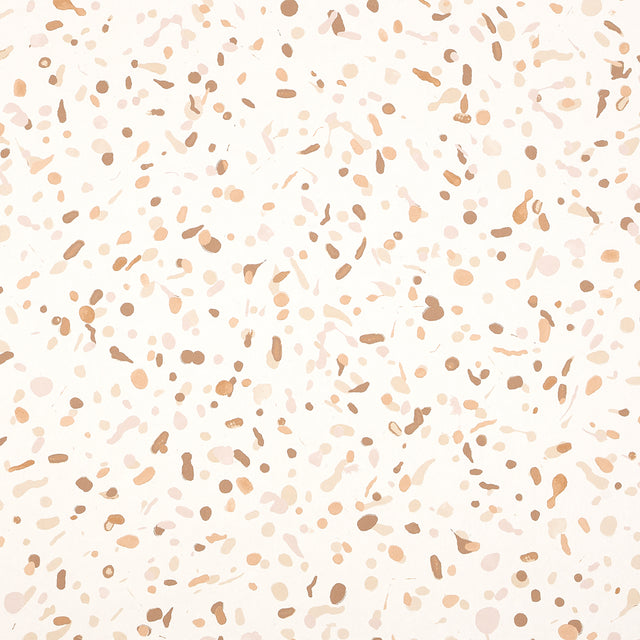 Los Cosmos Earth wallpaper by Schumacher features a dynamic allover pattern of random multidirectional paint splatters in earth tones.