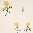Rhinestone Cowboy wallpaper in bright yellow with stylized floral pattern by Schumacher, shown in room and detail views.