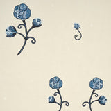 Rhinestone Cowboy navy floral wallpaper by Schumacher, featuring stylized blue flowers with chainstitch outlines and twinkling accents on a neutral background.