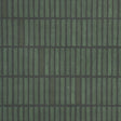 WABI-SABI Moss geometric grid wallpaper by Schumacher, hand-painted look in green tones, styled in a modern kitchen interior.