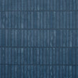 Wabi-Sabi dark blue geometric grid wallpaper by Schumacher, hand-painted look, styled in a modern kitchen interior.