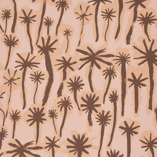 PALMITAS wallpaper in coral by Abel Macias for Schumacher, featuring hand-painted palm tree motifs in a painterly, tropical style.