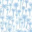 PALMITAS wallpaper in Mist by Abel Macias for Schumacher, featuring hand-painted blue palm trees on a white background.
