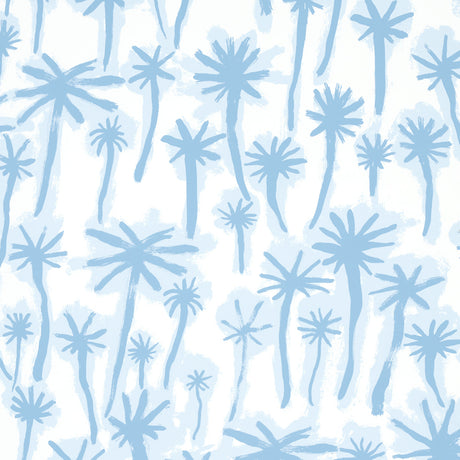 PALMITAS wallpaper in Mist by Abel Macias for Schumacher, featuring hand-painted blue palm trees on a white background.