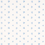 Margie Floral Porcelain wallpaper by Schumacher, featuring a delicate blue rosebud pattern on a white background.