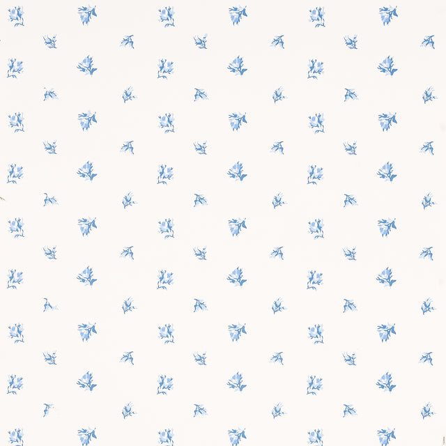 Margie Floral Porcelain wallpaper by Schumacher, featuring a delicate blue rosebud pattern on a white background.