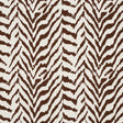 Quincy Cocoa animal print wallpaper from Schumacher's Moon River collection, shown in a styled interior and close-up detail.