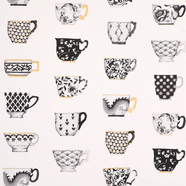 Onie's Teacups wallpaper in Ink by Schumacher, featuring hand-painted porcelain teacups with chinoiserie motifs in black, white, and gold.