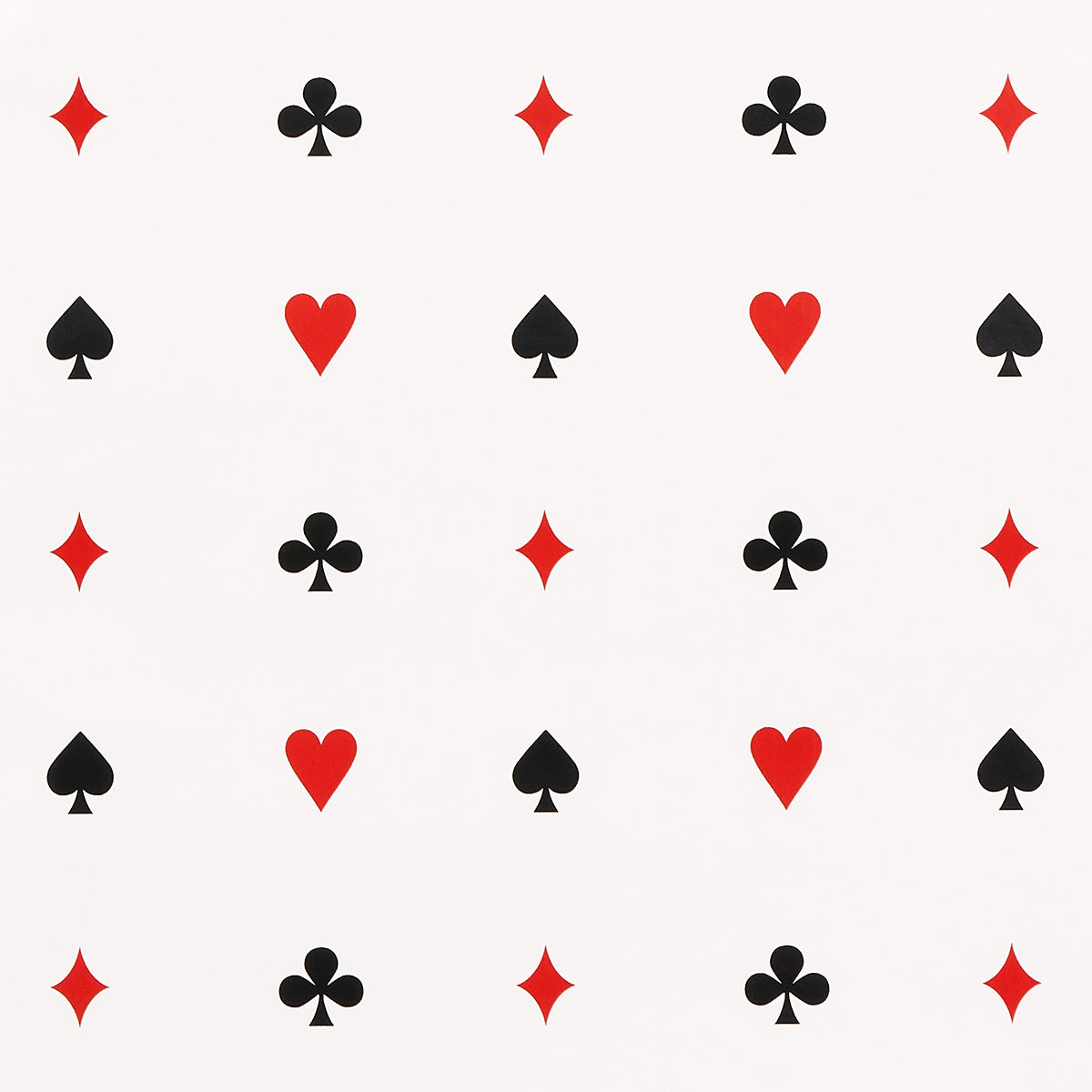 Le Joueur wallpaper in rouge-et-noir by Schumacher, featuring playful card suit motifs in red and black on a white background.