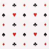 Le Joueur wallpaper in rouge-et-noir by Schumacher, featuring playful card suit motifs in red and black on a white background.