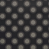 Watermark wallpaper by Neisha Crosland for Schumacher in black and white, featuring graphic circular moiré polka dots with optical effects.