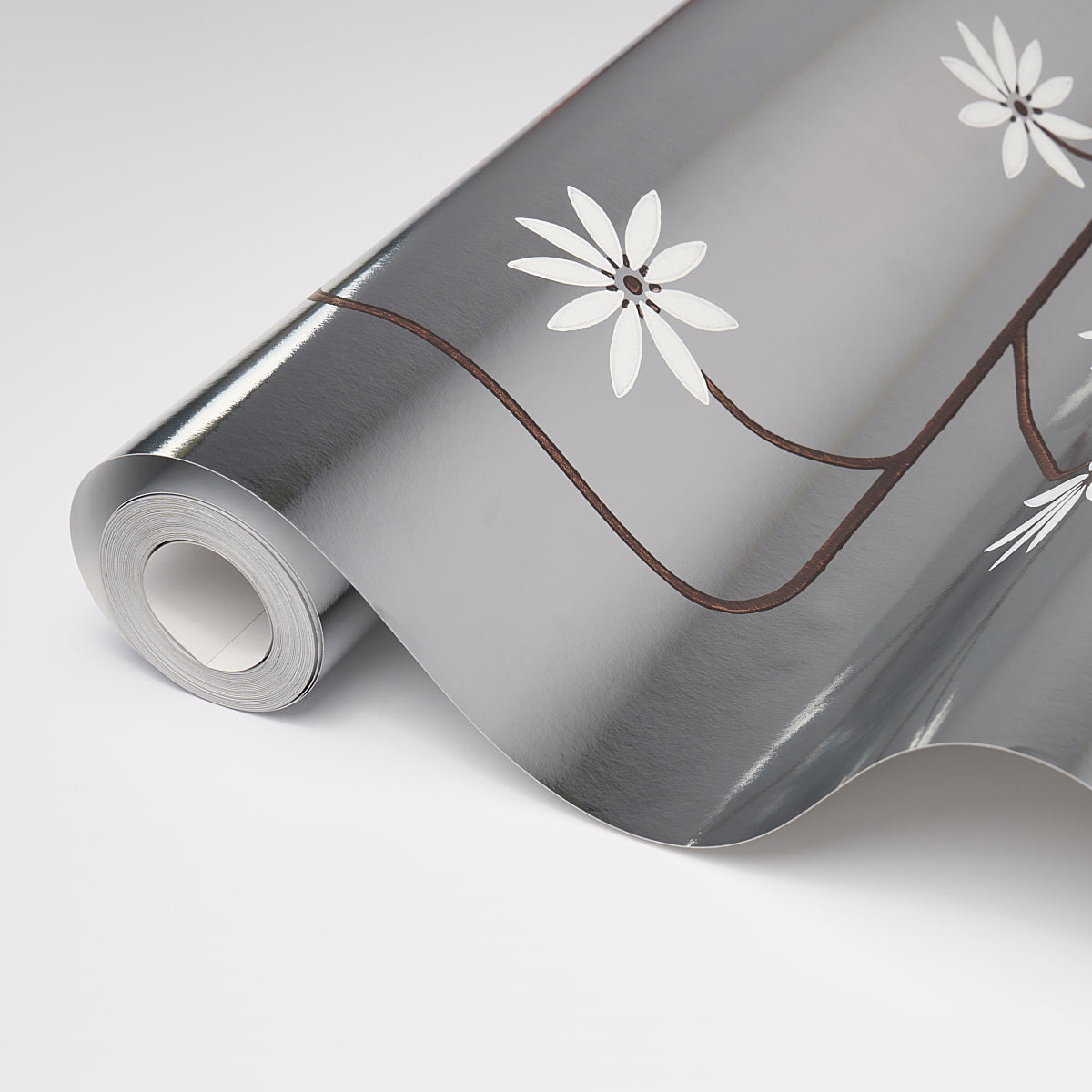 Hollywood Grape wallpaper in Aluminum by Neisha Crosland for Schumacher, featuring a geometric flowering fruit vine on a metallic ground.